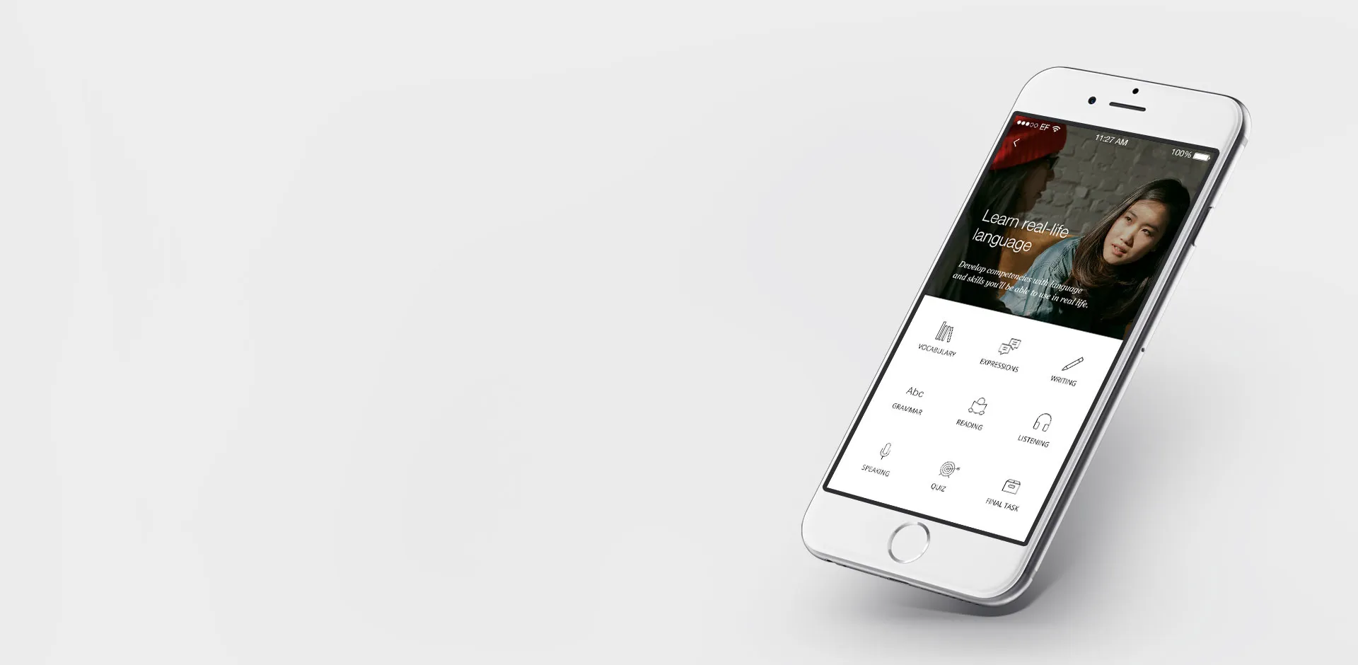 An iphone with the English Live app. The screen reads: Learn real life language and shows categories for learning: vocabulary, expressions, writing, grammar, reading, listening, speaking, quiz, final task.